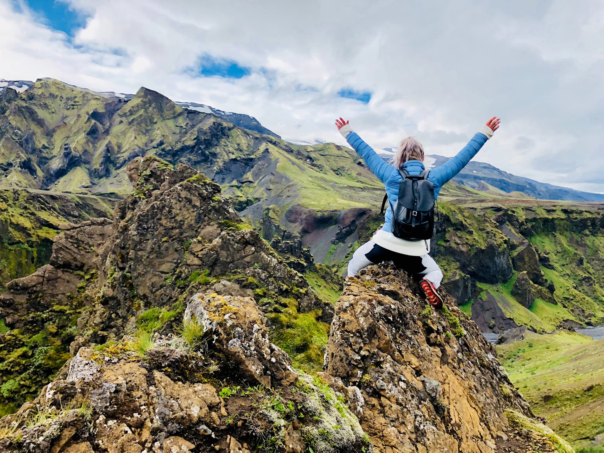 woman climbing a mountain